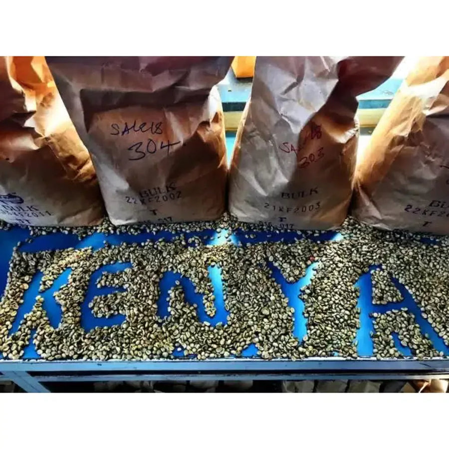 Green kenya coffee after being harvested spelling out KENYA